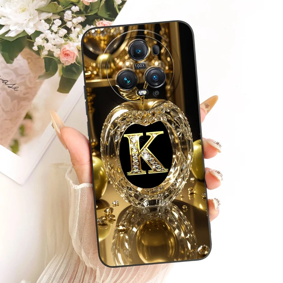 Honor Magic 5 Pro Hülle in Schwarz-Gold, Rückseite mit goldenem Kristallapfel-Motiv und Initiale K mit Diamanten