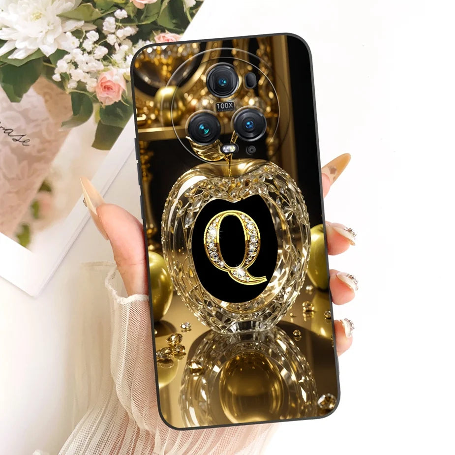 Honor Magic 5 Schutzhülle mit goldenem Kristall-Apfel-Aufdruck und diamantbesetztem Buchstaben Q, schwarze Silikonhülle