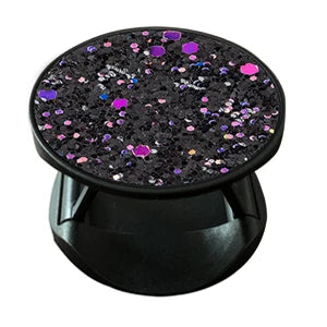 Pop-Up Handy Fingerring Ständer in Schwarz, Draufsicht, runde Oberfläche mit schwarzem Glitzer und pinken sowie lila Paillett
